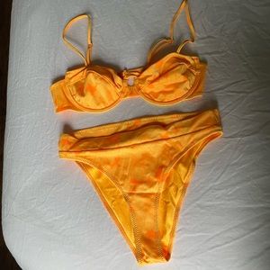 Never worn triangl bikini. Size large bottom and size medium top